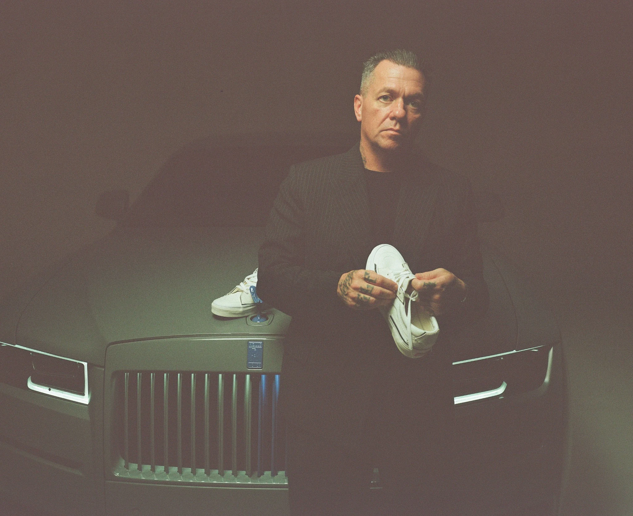 Ryan Friedlinghaus standing in front of a Rolls-Royce